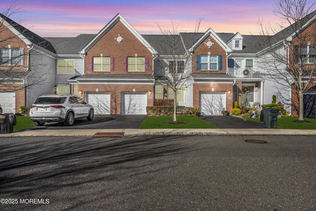 a view of multiple houses with a street
