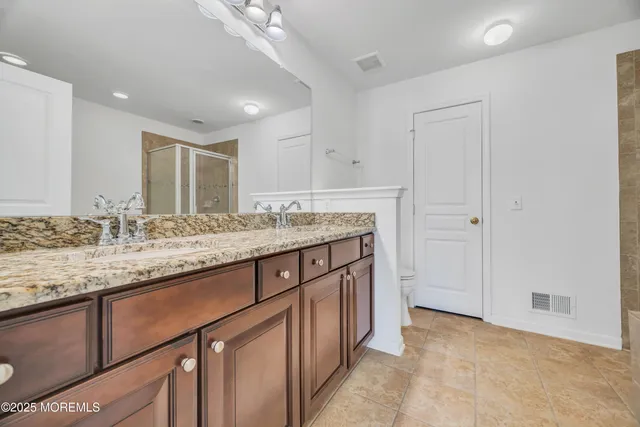 a bathroom with a tub and shower