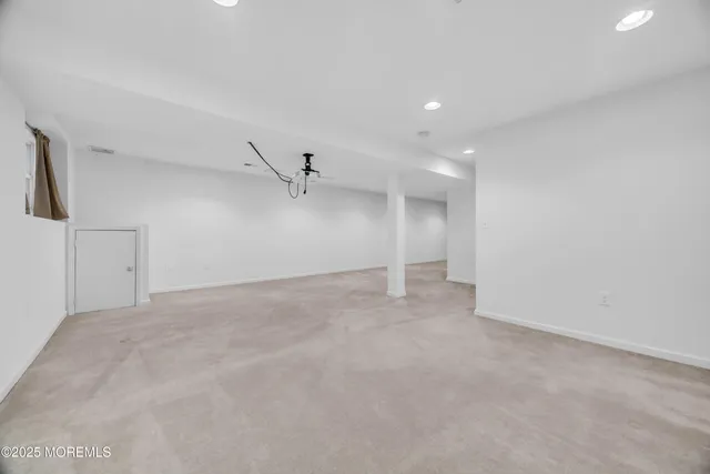 a view of a deck with wooden floor and a wooden fence