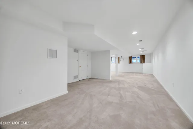 a balcony with wooden floor and fence