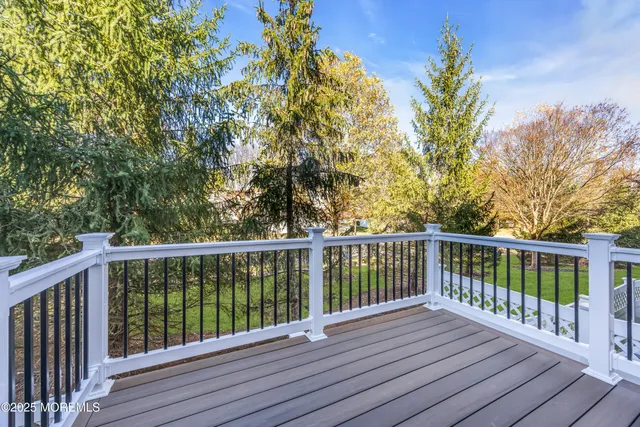 an aerial view of residential house with outdoor space and swimming pool