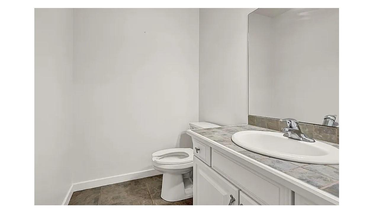 190 Penaluna Road Monroe, NY 10950 - Photo 27 of 36 a bathroom with a granite countertop toilet and a sink