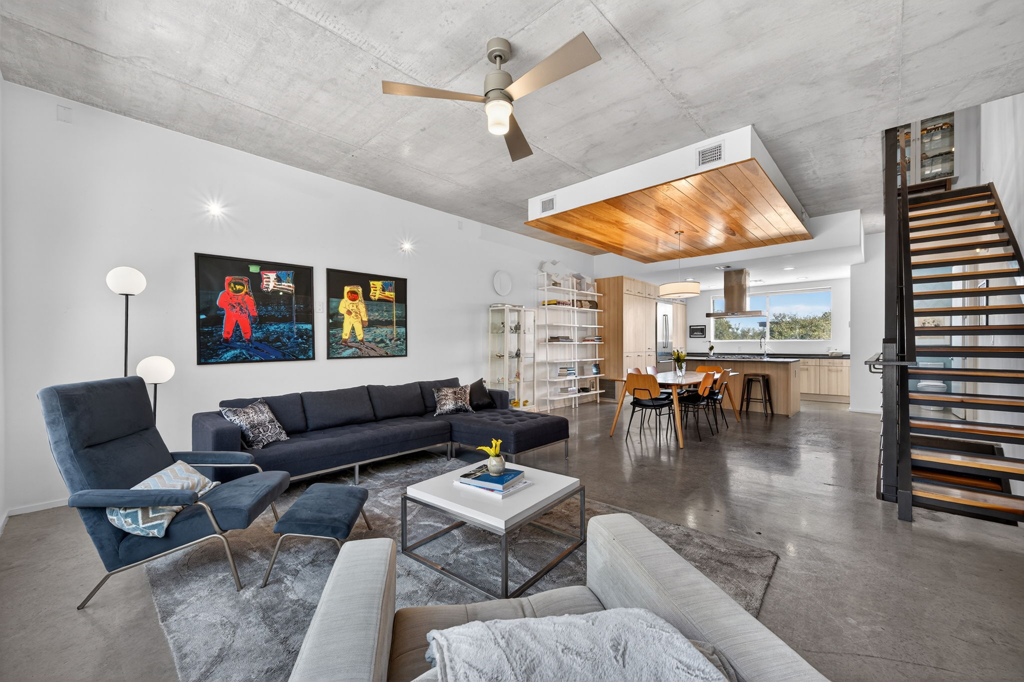 2301 South 5th Street, Unit 25 Austin, TX 78704 - Photo 14 of 35 Living area with finished concrete flooring and ceiling fan