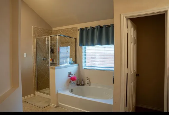 a bathroom with a sink vanity and mirror