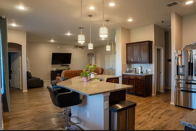 an aerial view of a house with a yard