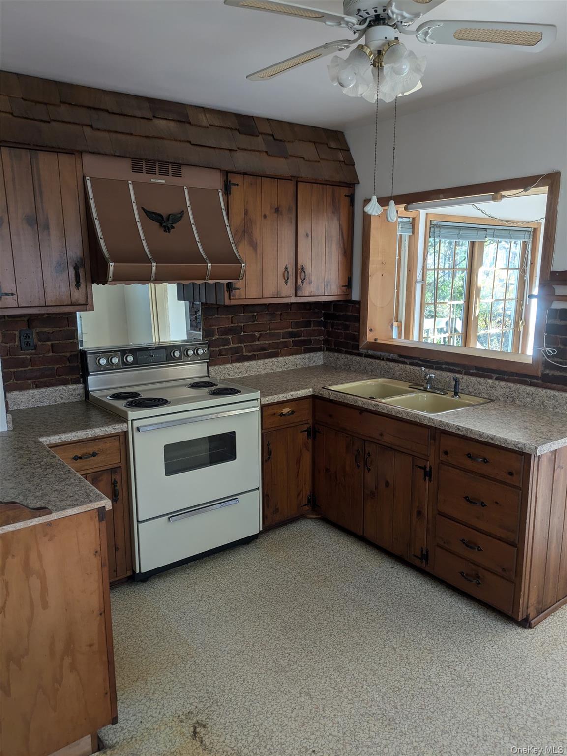 55 Old Little Britain Road Newburgh, NY 12550 - Photo 10 of 44 a kitchen with granite countertop a stove sink and cabinets
