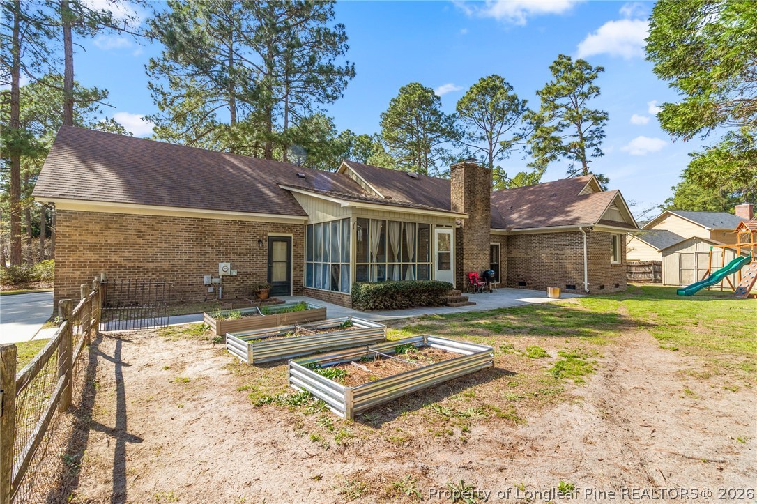 7756 Dragonhead Road Fayetteville, NC 28311 - Photo 40 of 42 a front view of a house with garden