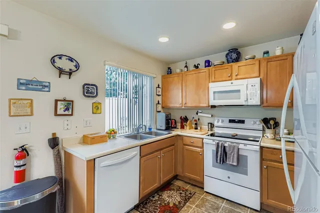 a view of a kitchen with a stove top oven