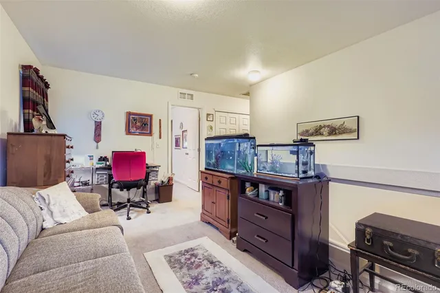 a living room with furniture and furniture