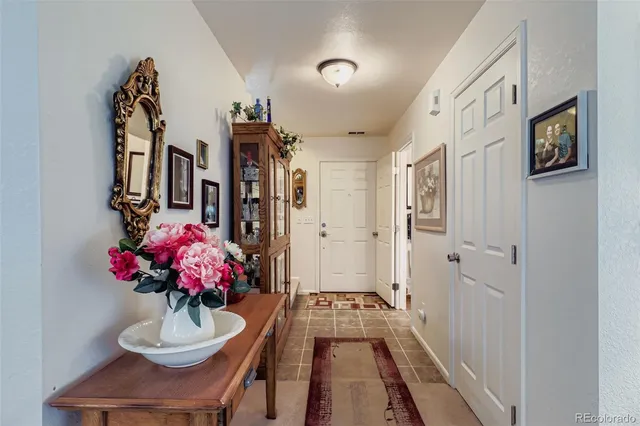 a dining room with furniture and a chandelier