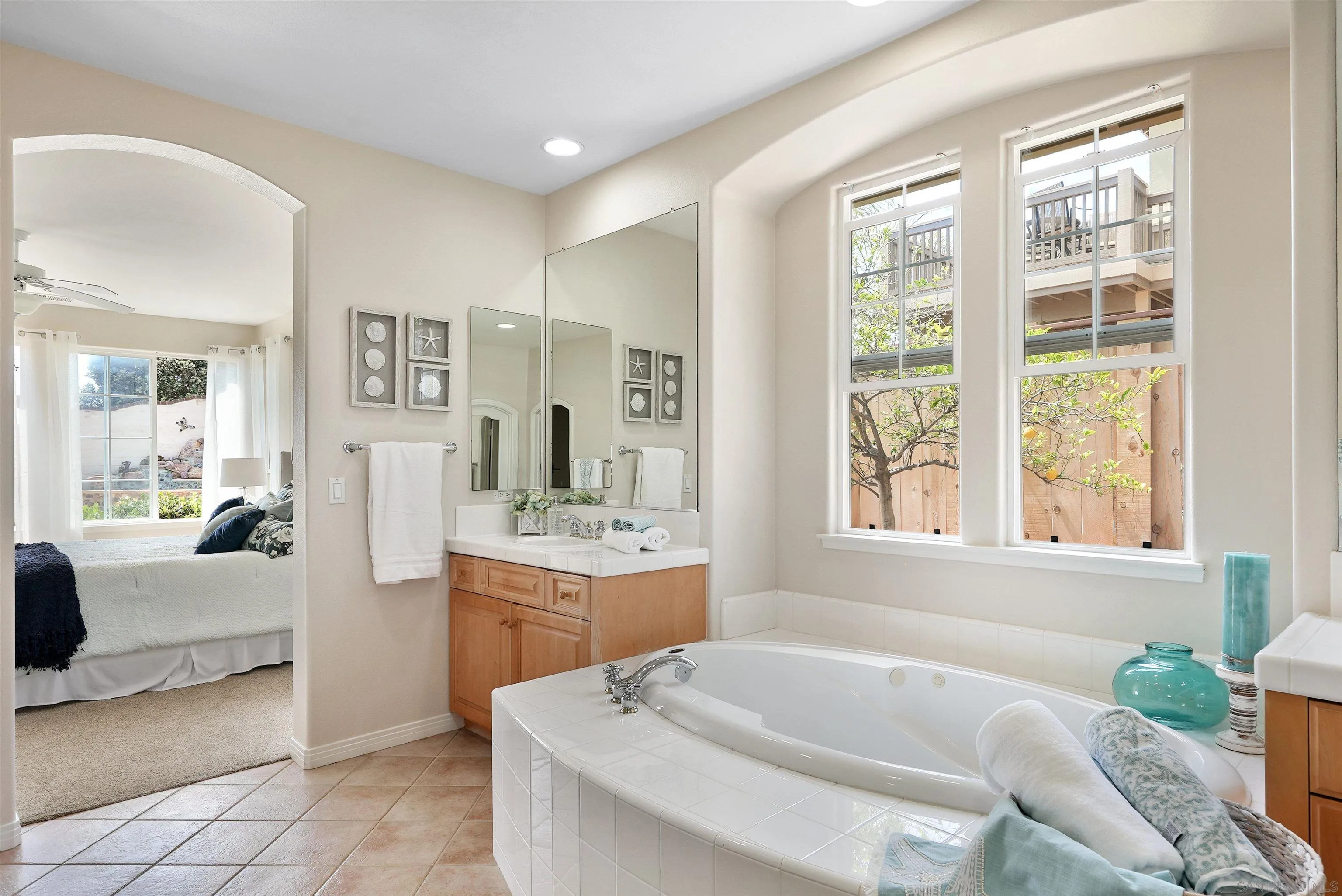 7539 Reeve Road Carlsbad, CA 92011 - Photo 13 of 30 a spacious bathroom with a granite countertop tub sink and mirror