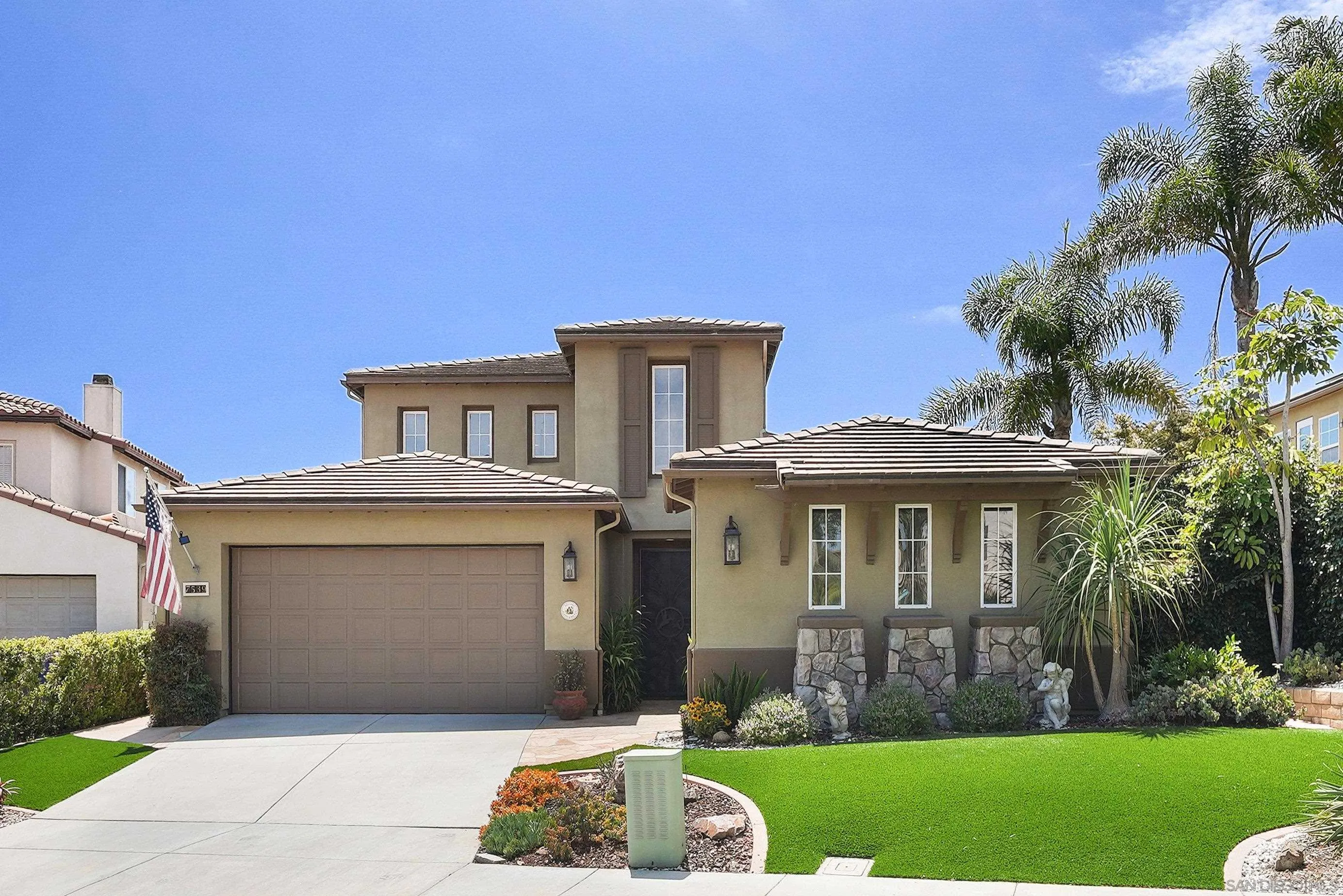 7539 Reeve Road Carlsbad, CA 92011 - Photo 2 of 30 a front view of a house with a yard and garage