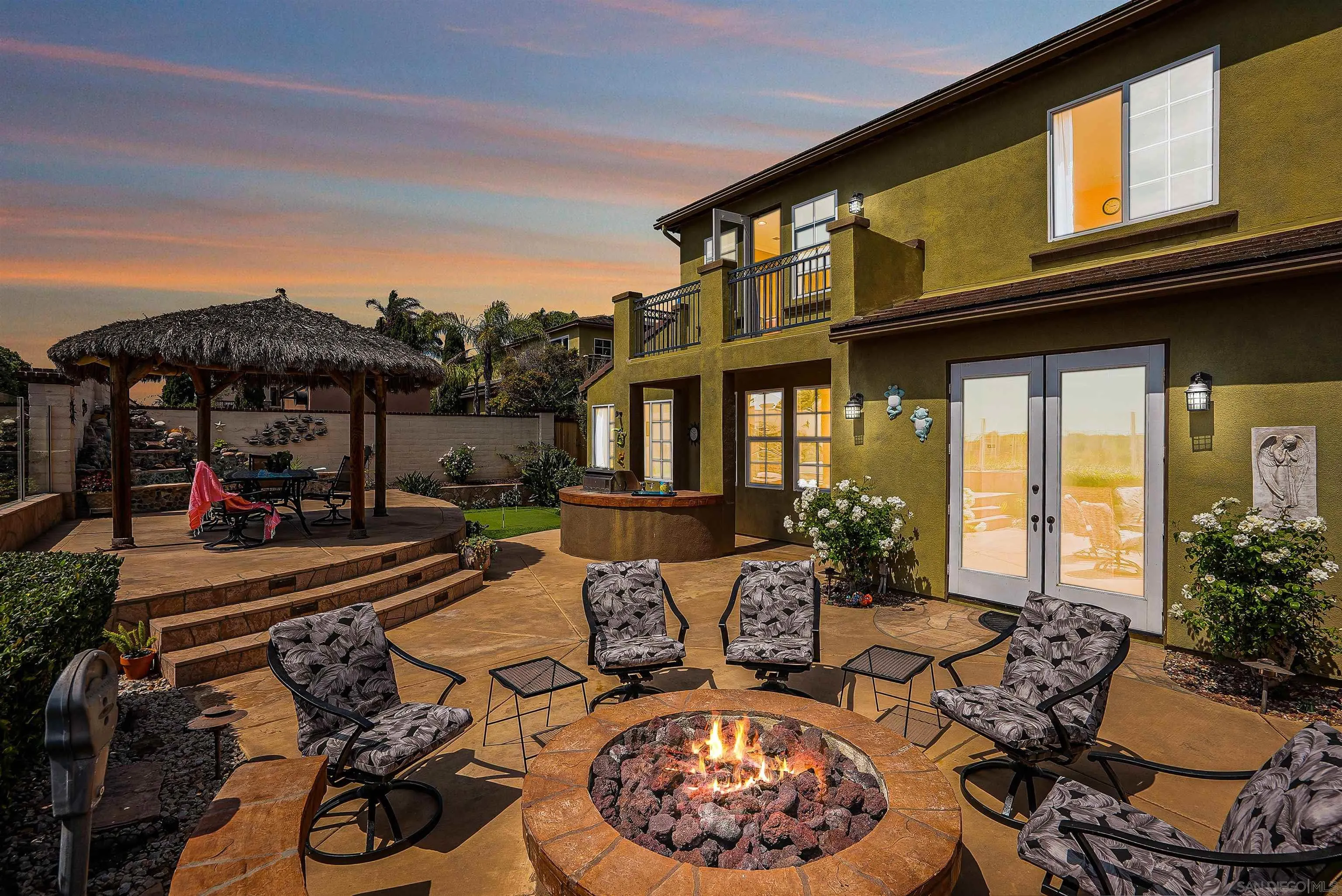 7539 Reeve Road Carlsbad, CA 92011 - Photo 29 of 30 a view of a patio with couches table and chairs with potted plants and sky view