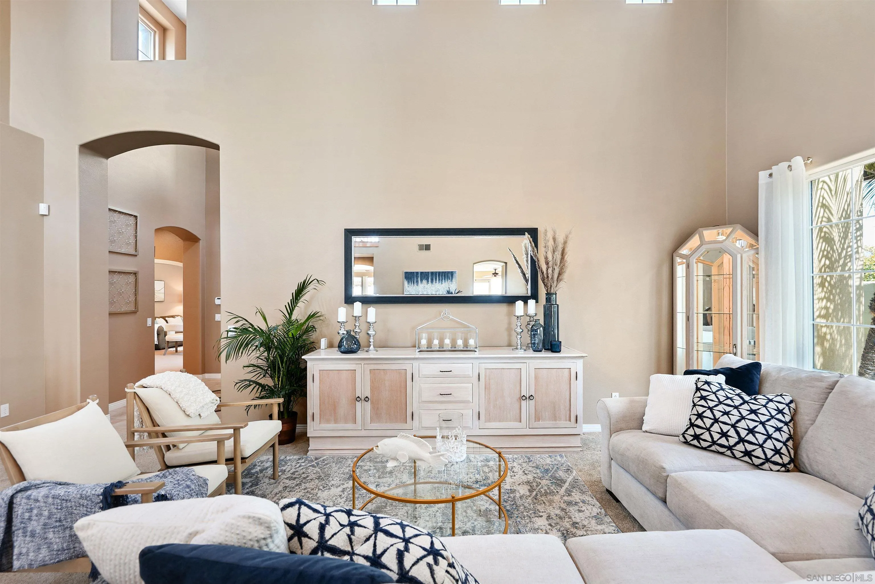 7539 Reeve Road Carlsbad, CA 92011 - Photo 3 of 30 a living room with furniture and a large mirror