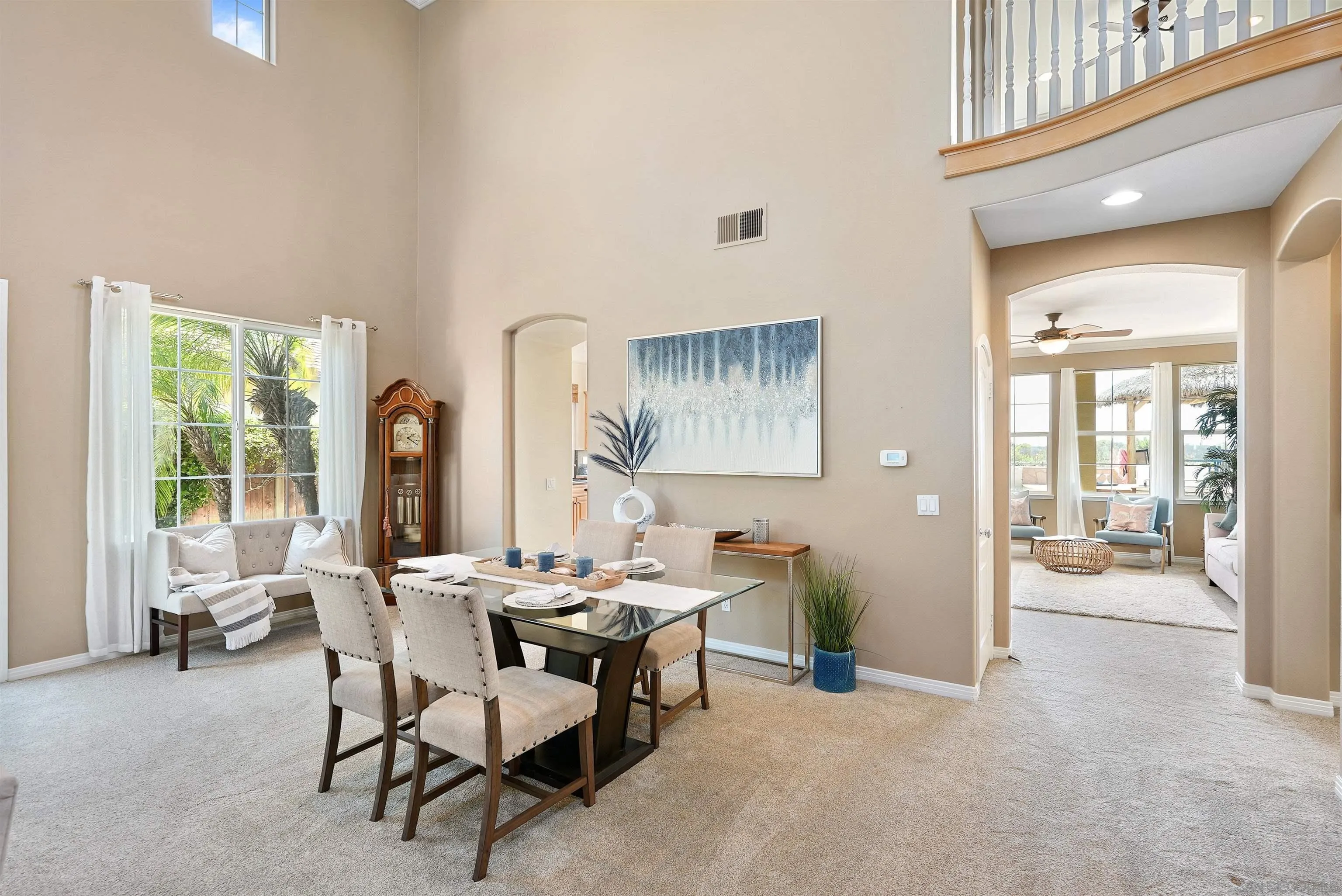 7539 Reeve Road Carlsbad, CA 92011 - Photo 4 of 30 a dining room with furniture and a floor to ceiling window