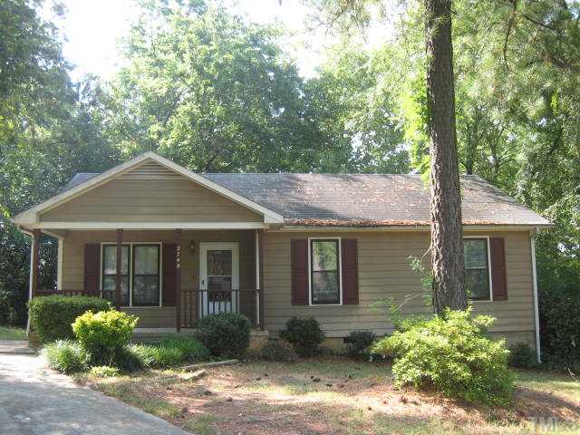 2748 Community Drive Raleigh, NC 27610 - Photo 1 of 5 a front view of a house with garden
