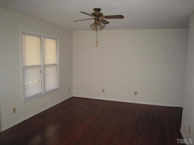 2748 Community Drive Raleigh, NC 27610 - Photo 3 of 5 a view of room with hardwood floor and ceiling fan