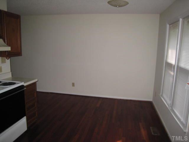 2748 Community Drive Raleigh, NC 27610 - Photo 5 of 5 a view of a kitchen with wooden floor and a sink