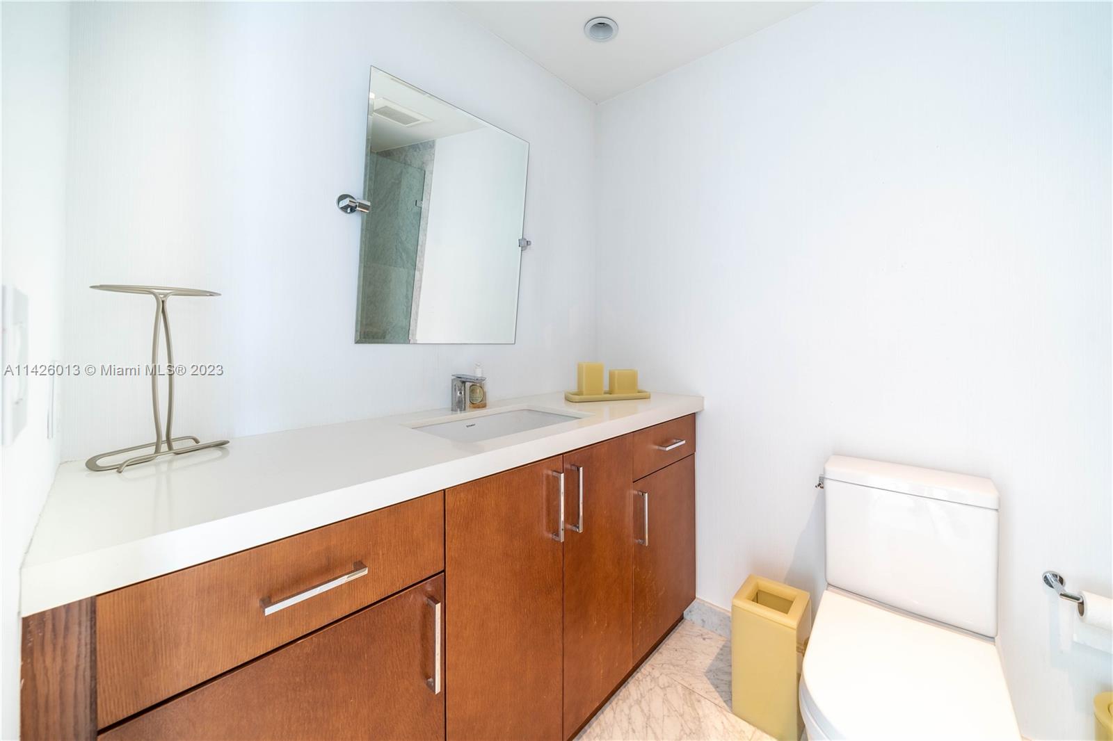 Palm Island Miami Beach, FL 33139 - Photo 21 of 50 a bathroom with a sink and a mirror