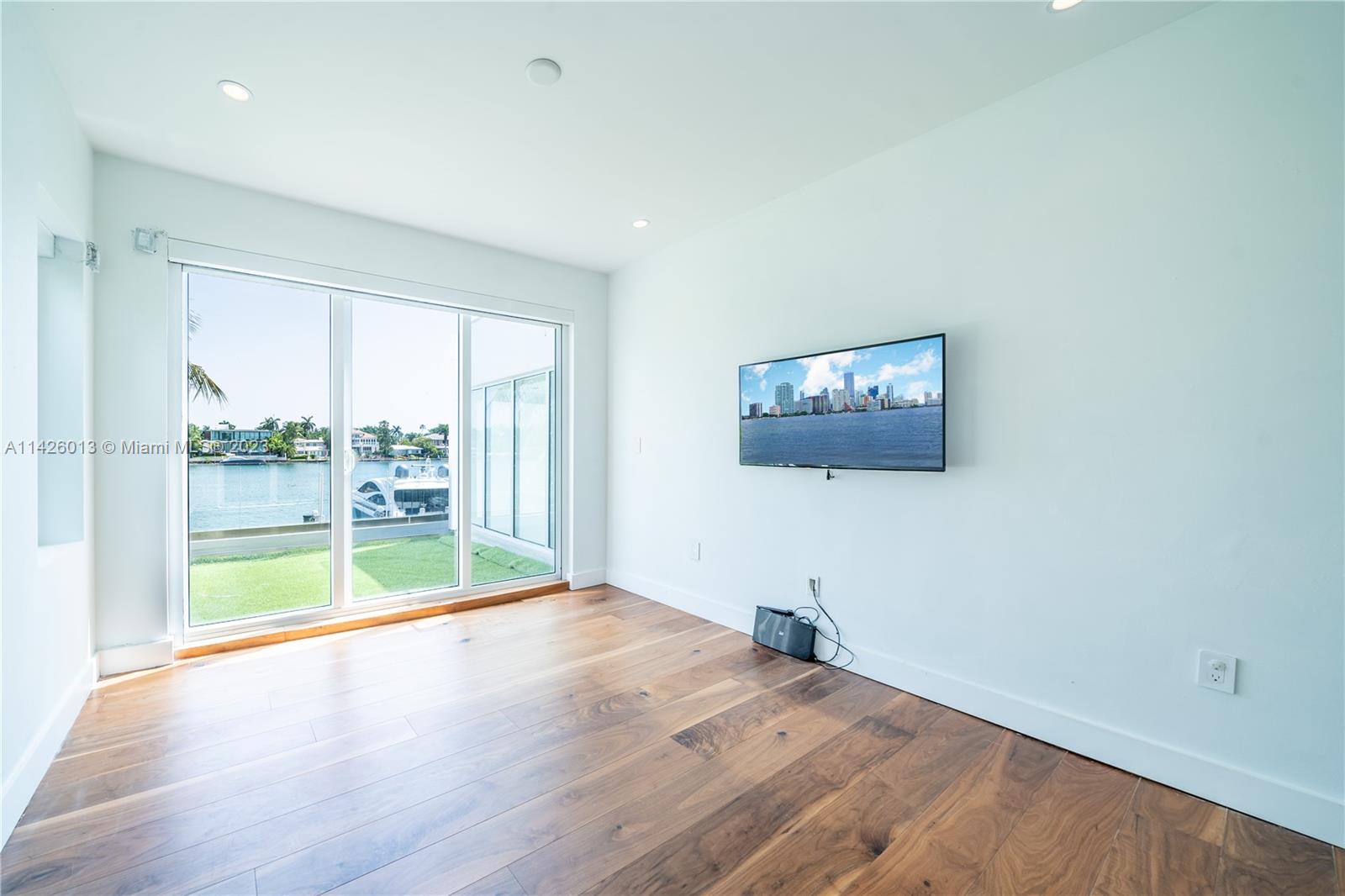 Palm Island Miami Beach, FL 33139 - Photo 26 of 50 a view of a room with wooden floor and a window