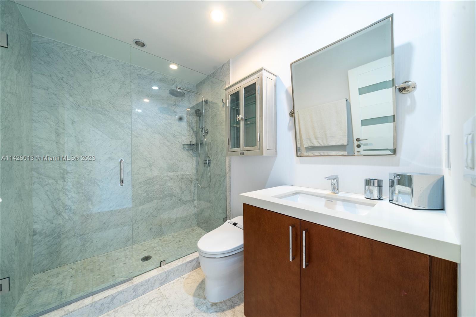 Palm Island Miami Beach, FL 33139 - Photo 29 of 50 a bathroom with a sink a toilet and shower