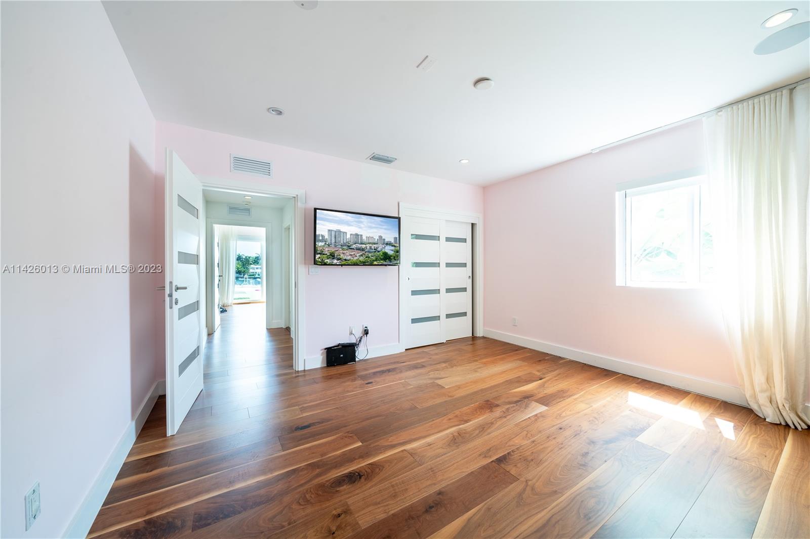 Palm Island Miami Beach, FL 33139 - Photo 34 of 50 a view of a big room with wooden floor and windows