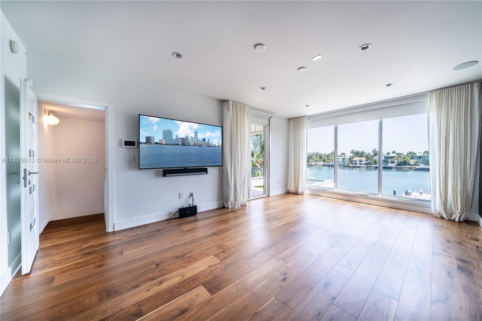 Palm Island Miami Beach, FL 33139 - Photo 38 of 50 a view of a room with wooden floor and a window