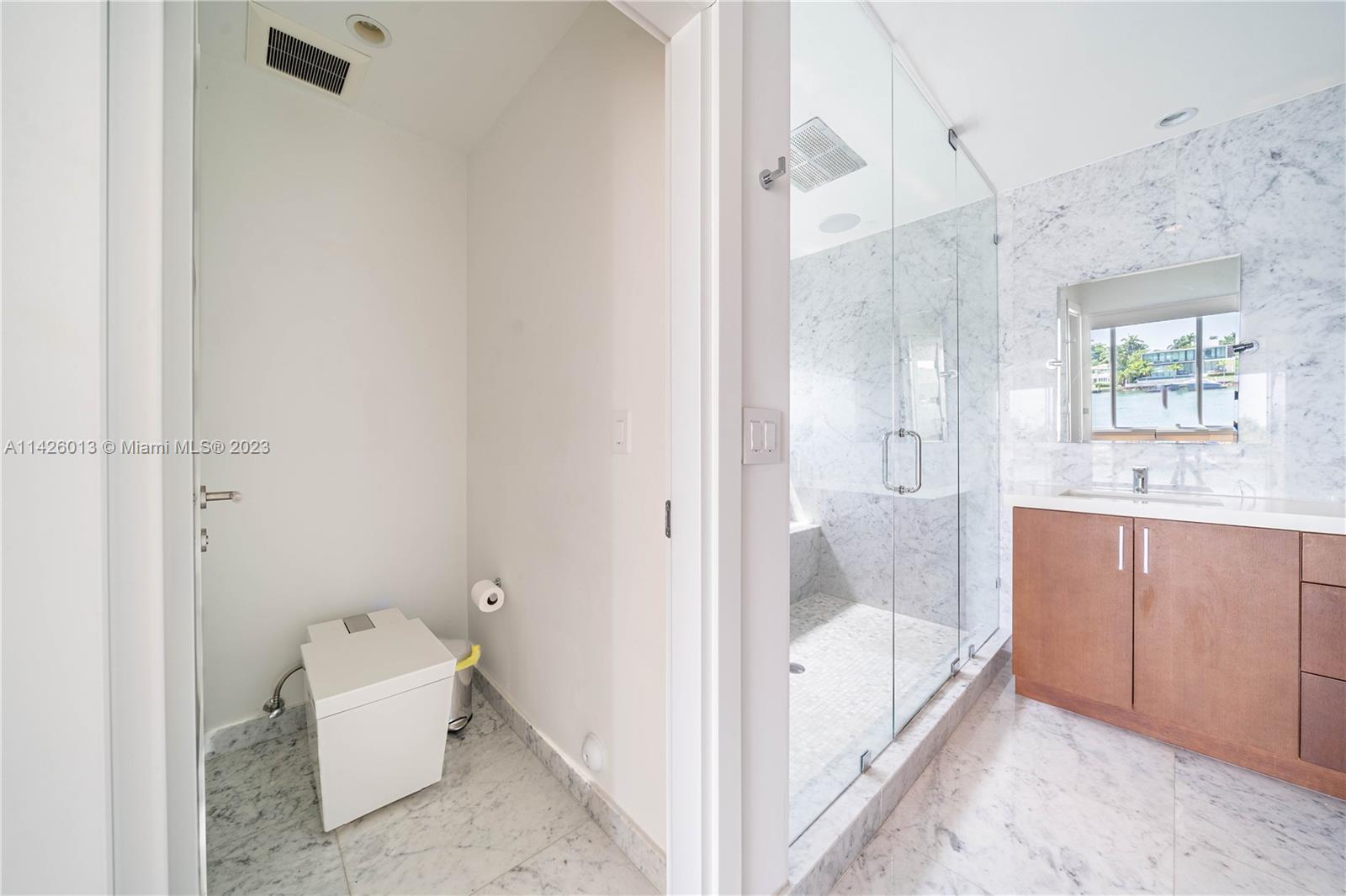 Palm Island Miami Beach, FL 33139 - Photo 39 of 50 a bathroom with a tub shower and mirror