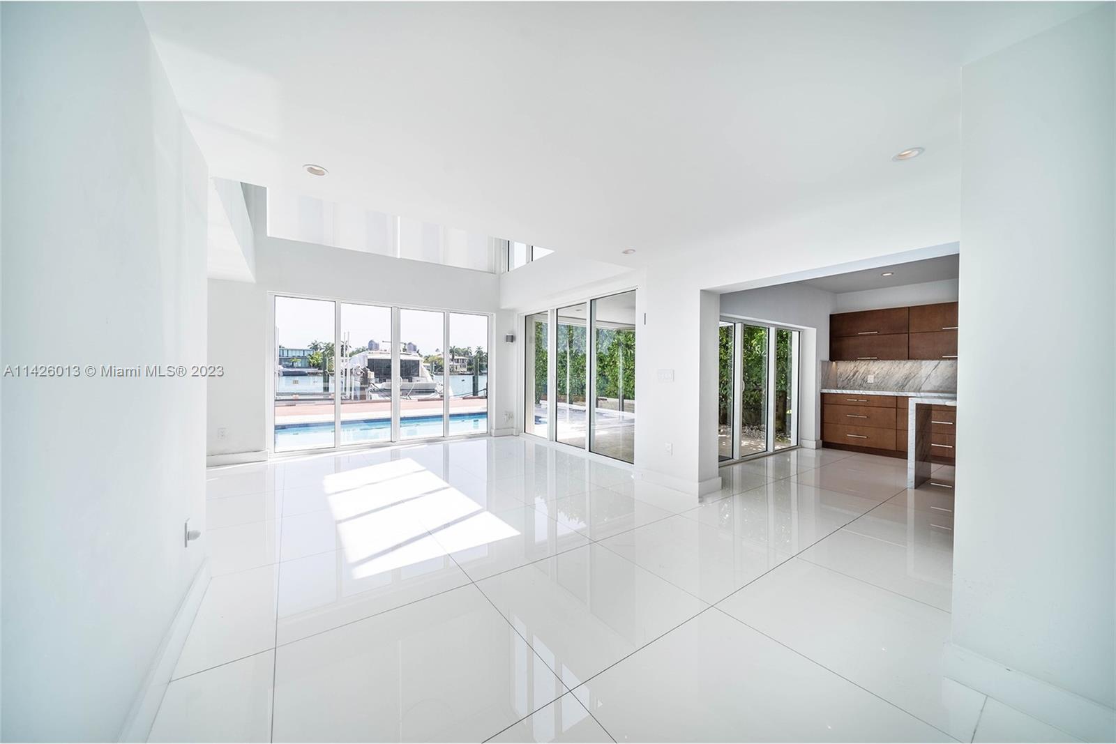 Palm Island Miami Beach, FL 33139 - Photo 9 of 50 a view of open kitchen with furniture and floor to ceiling window