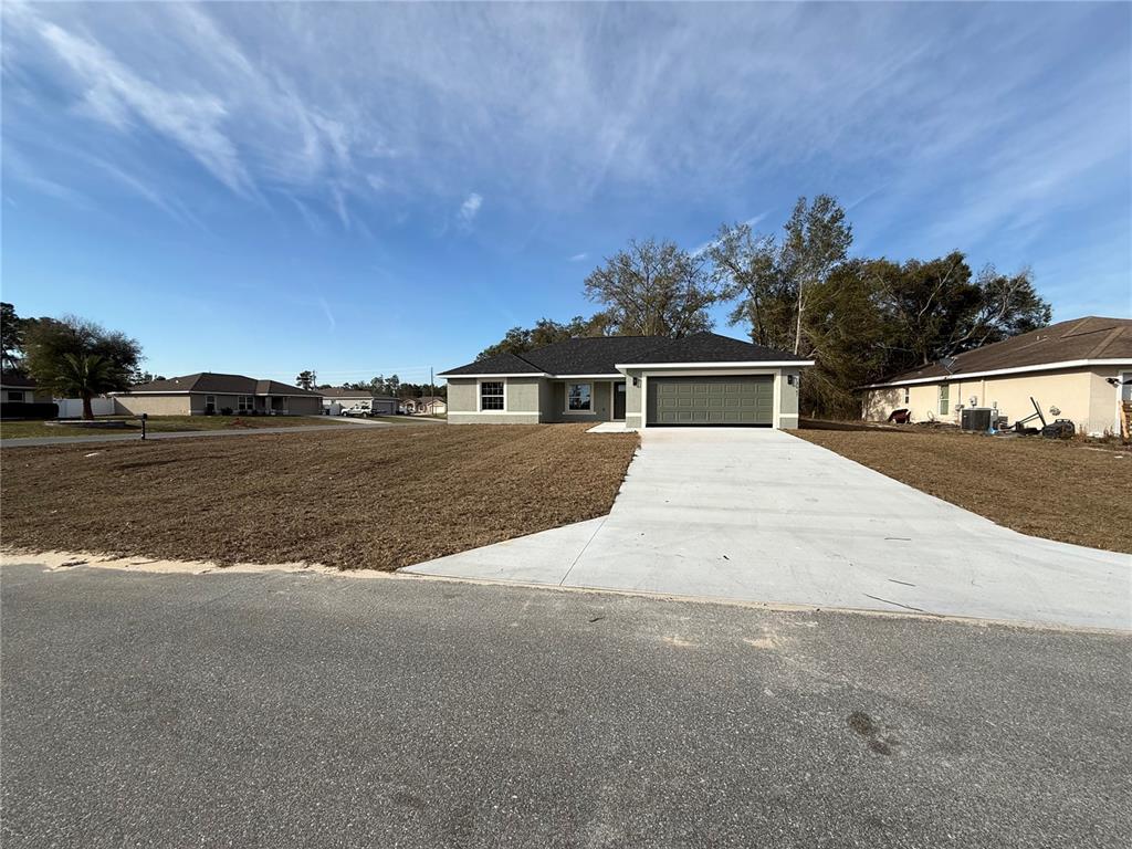 5447 Southwest 129th Place Ocala, FL 34473 - Photo 1 of 1 a view of house with outdoor space and sitting area