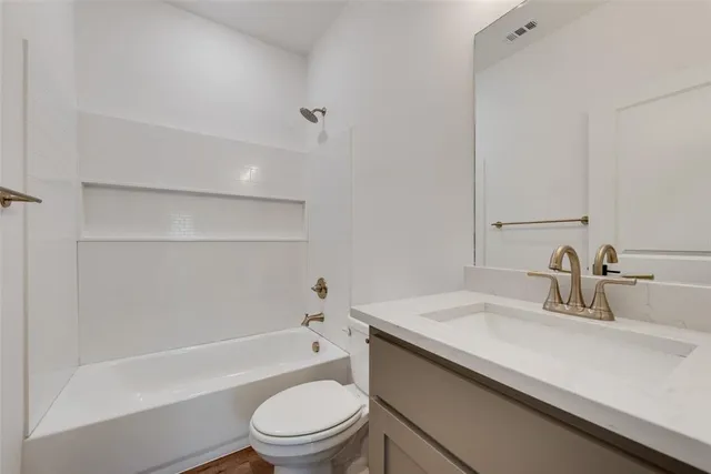 a bathroom with a sink a toilet and a bathtub