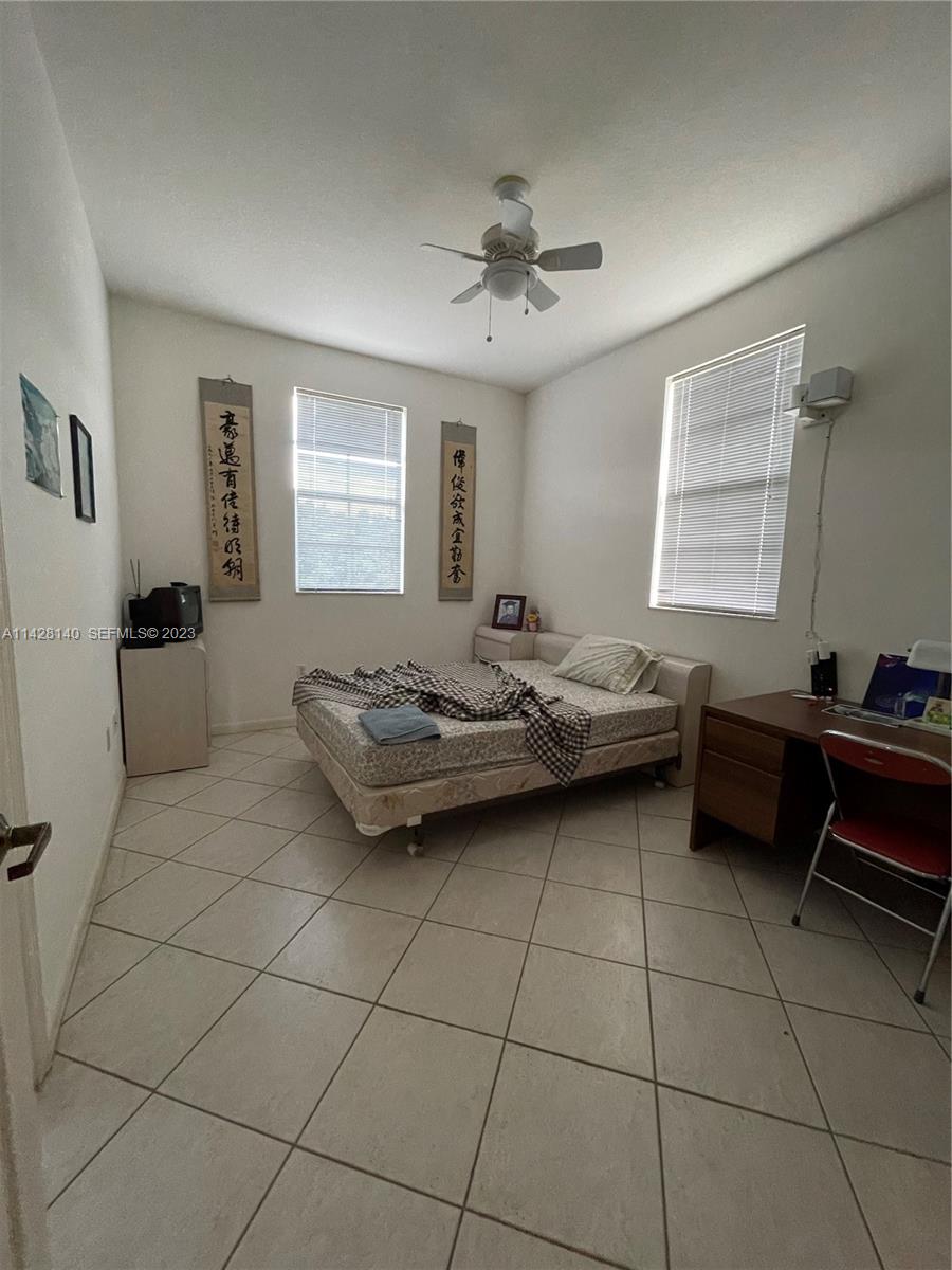 33300 Southwest 202nd Avenue Homestead, FL 33030 - Photo 15 of 42 a living room with furniture and window