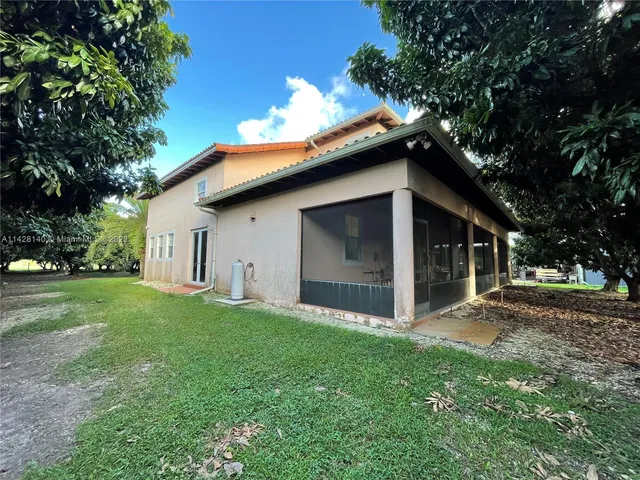 a backyard of a house with lots of green space