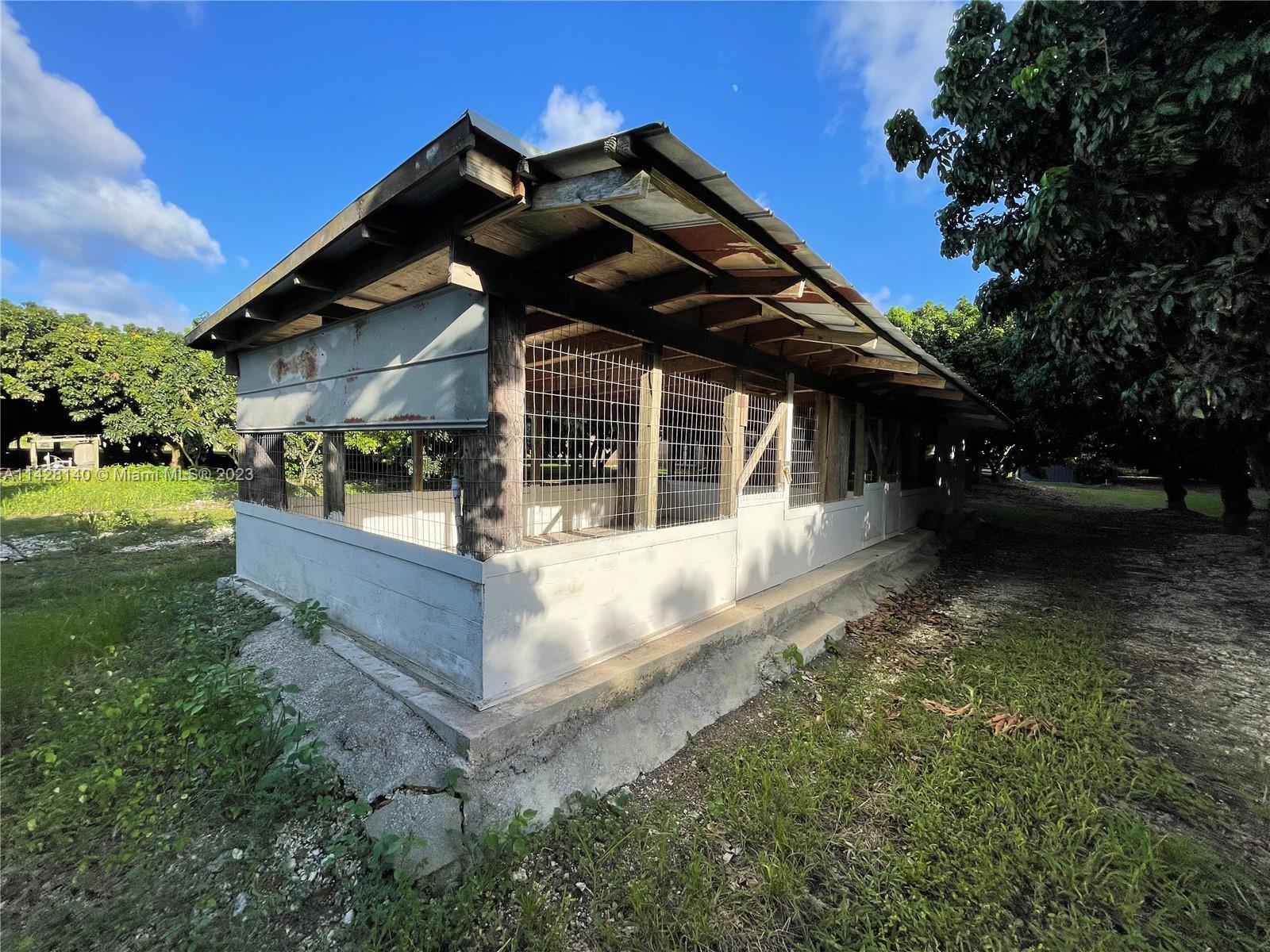 33300 Southwest 202nd Avenue Homestead, FL 33034 - Photo 23 of 42 front view of house with a yard