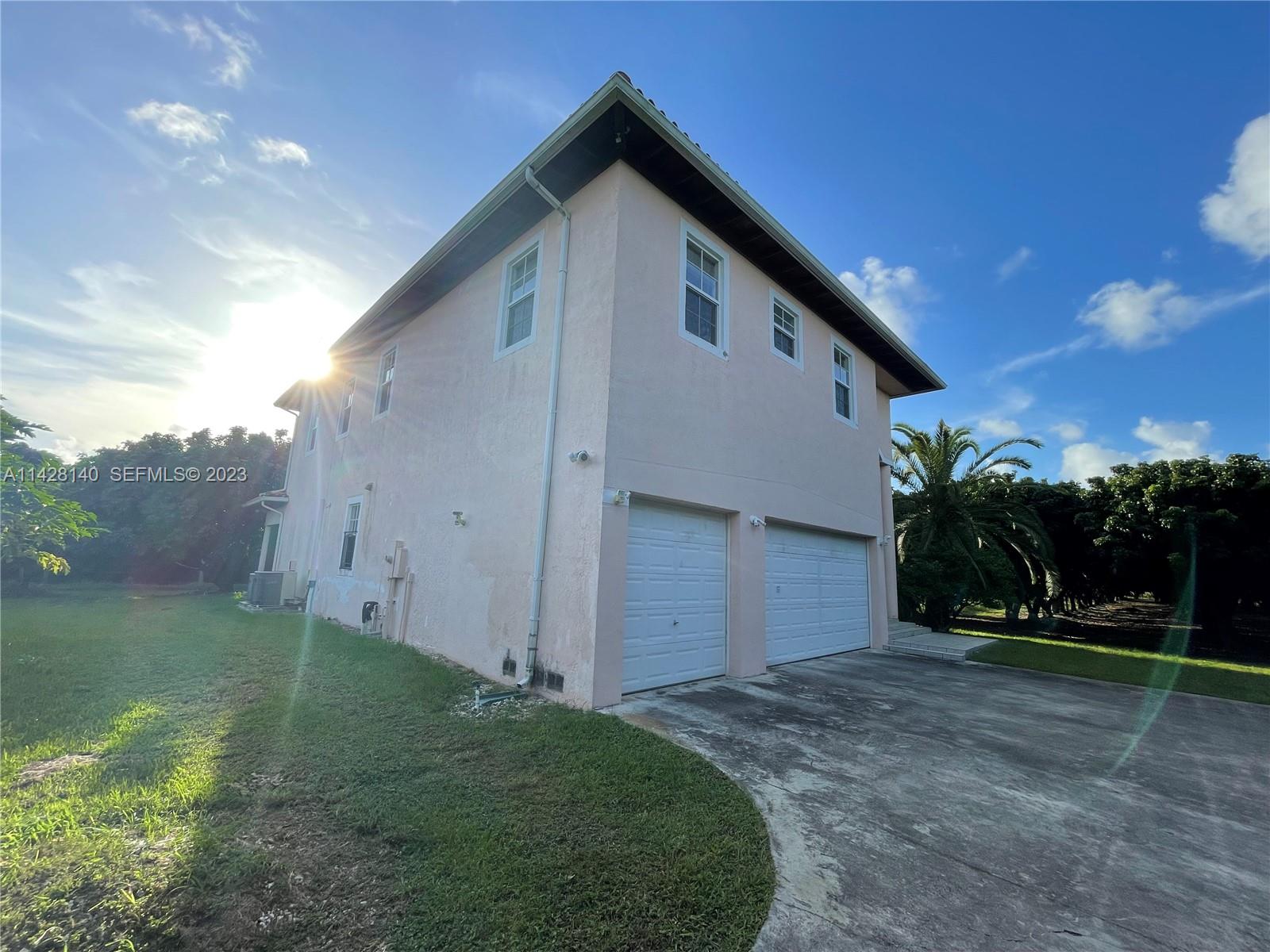 33300 Southwest 202nd Avenue Homestead, FL 33030 - Photo 25 of 42 a front view of house with yard and trees