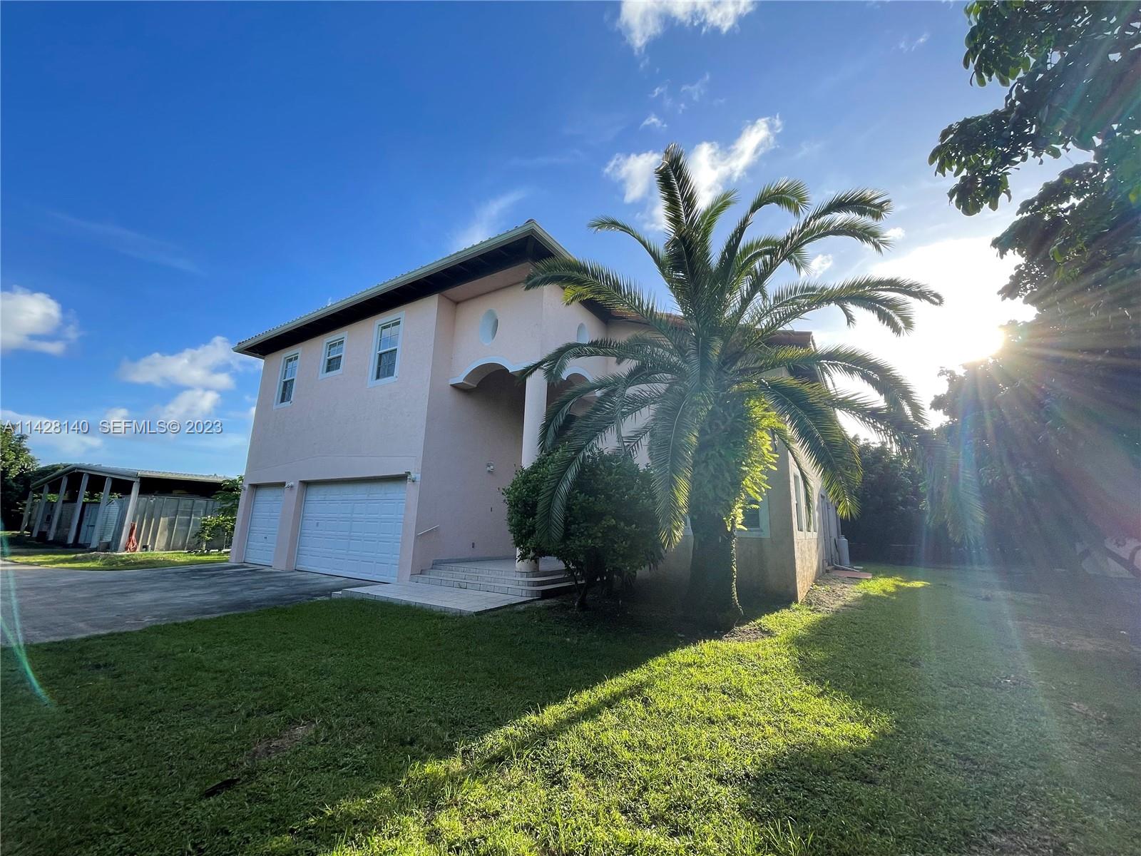 33300 Southwest 202nd Avenue Homestead, FL 33030 - Photo 26 of 42 a view of a house with a yard