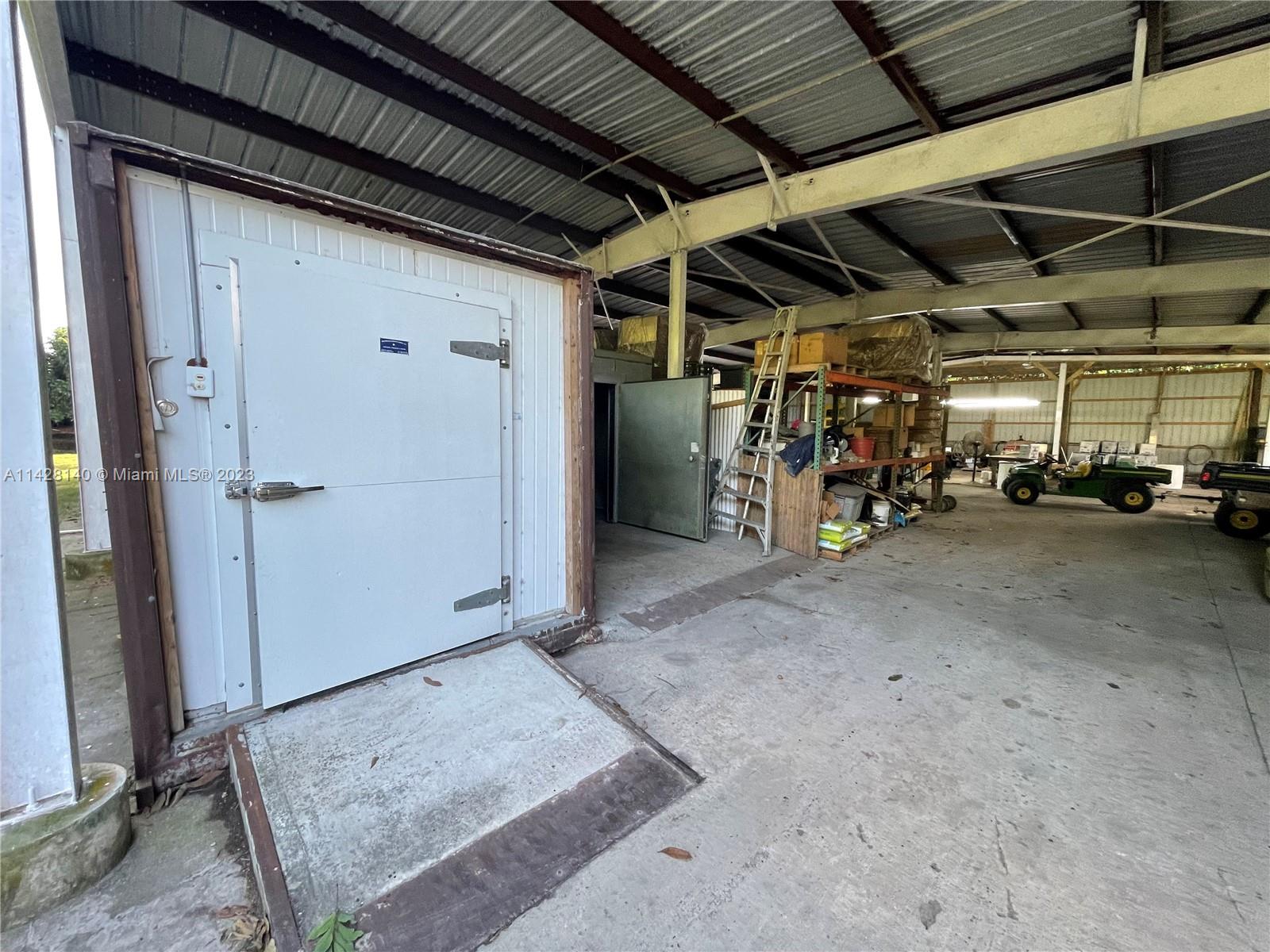 33300 Southwest 202nd Avenue Homestead, FL 33034 - Photo 27 of 42 a view of parking garage with cars