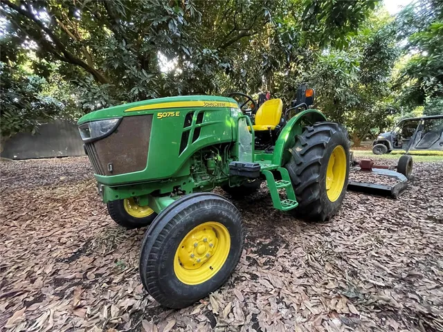 a view of a room with gym equipment and a garden