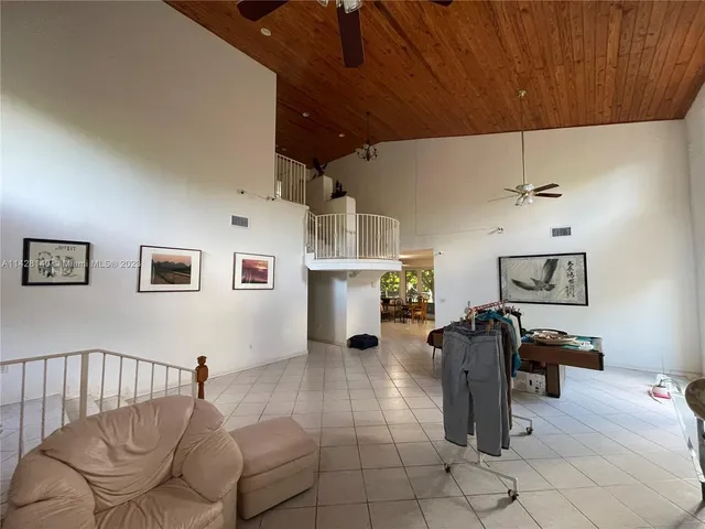a view of a dining room with furniture and window