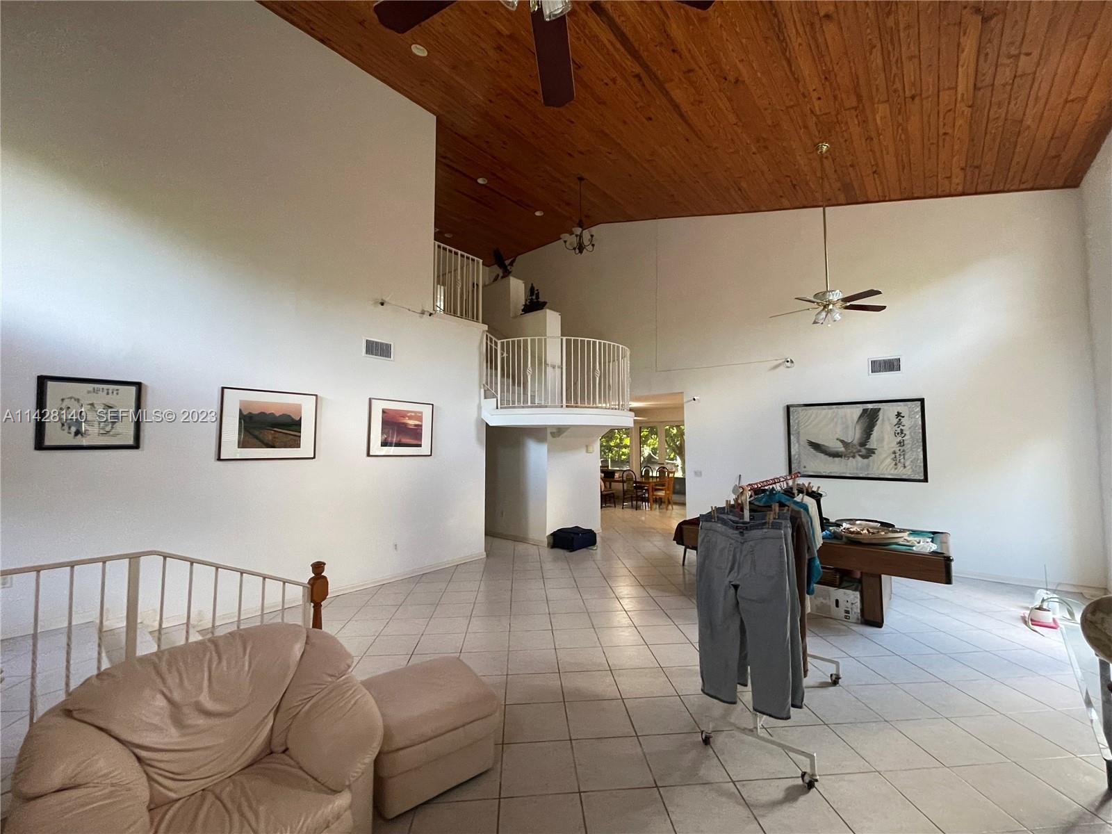 33300 Southwest 202nd Avenue Homestead, FL 33030 - Photo 6 of 42 a livingroom with furniture workspace and a window