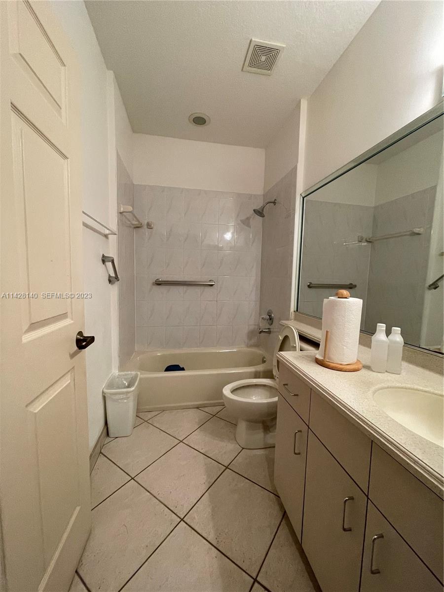 33300 Southwest 202nd Avenue Homestead, FL 33030 - Photo 10 of 42 a bathroom with a sink a toilet and shower