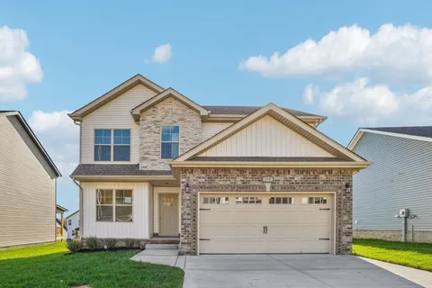 a view of a house with yard
