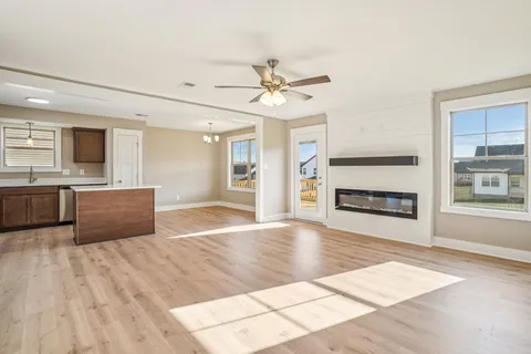 a kitchen with stainless steel appliances granite countertop a refrigerator sink and stove