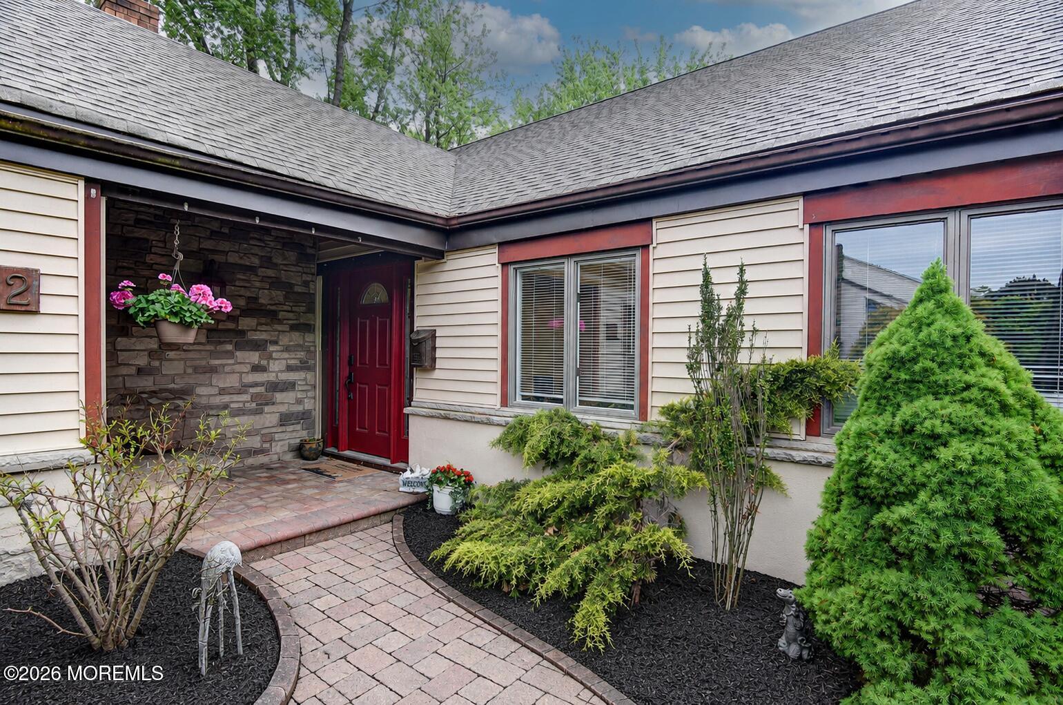 32 Ethan Allen Road Freehold, NJ 07728 - Photo 3 of 34 32EthanFrontCoveredPorchEnhancedMulch