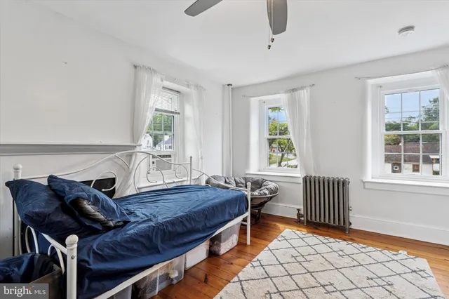 a bedroom with furniture and a window