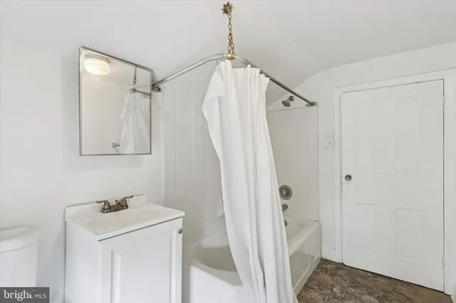 a bathroom with a sink a vanity and a mirror