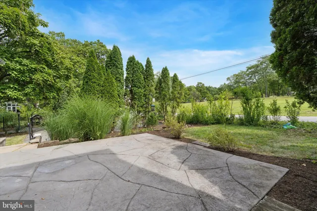 a view of a street with a building in the background