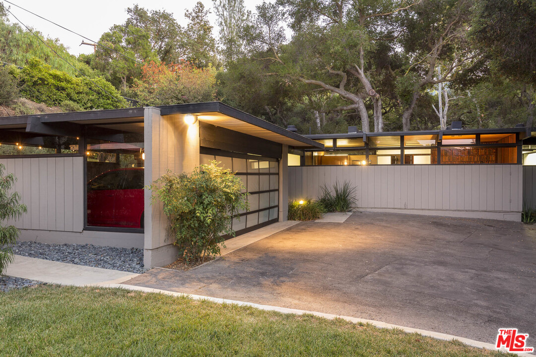 616 Cold Canyon Road Calabasas, CA 91302 - Photo 2 of 51 a front view of a house with a yard and tree s