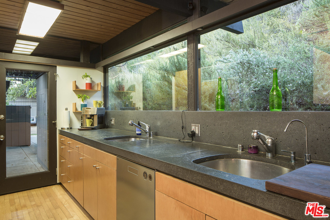 616 Cold Canyon Road Calabasas, CA 91302 - Photo 12 of 51 a kitchen with a sink and a large window