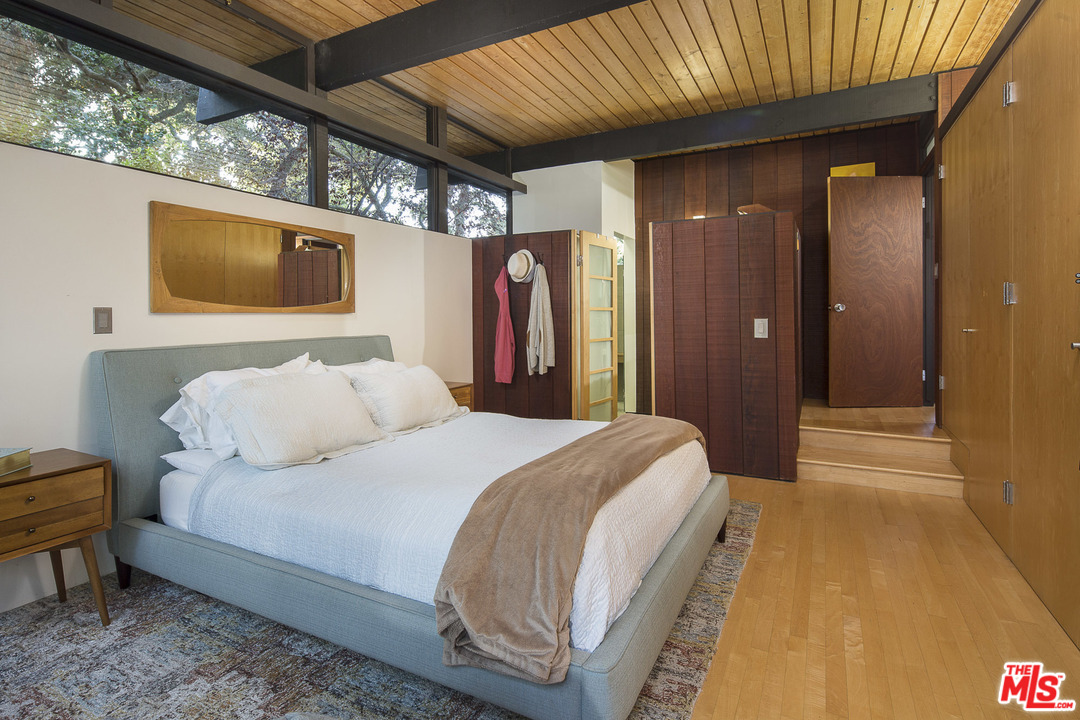 616 Cold Canyon Road Calabasas, CA 91302 - Photo 18 of 51 a spacious bedroom with a bed and a shower